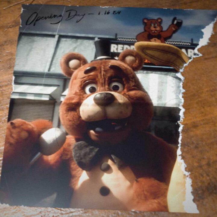 Torn photograph of Freddy's grand opening